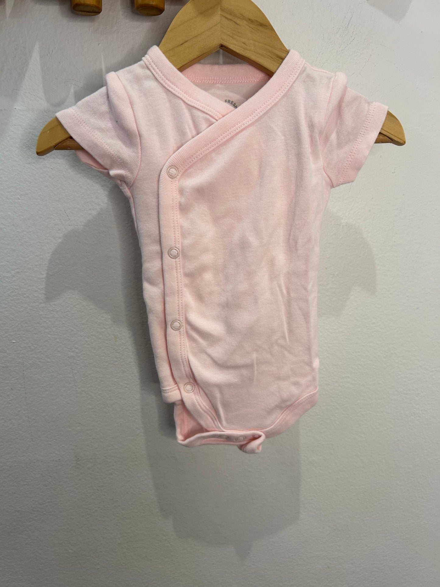 Light pink side button onesie 0-3m