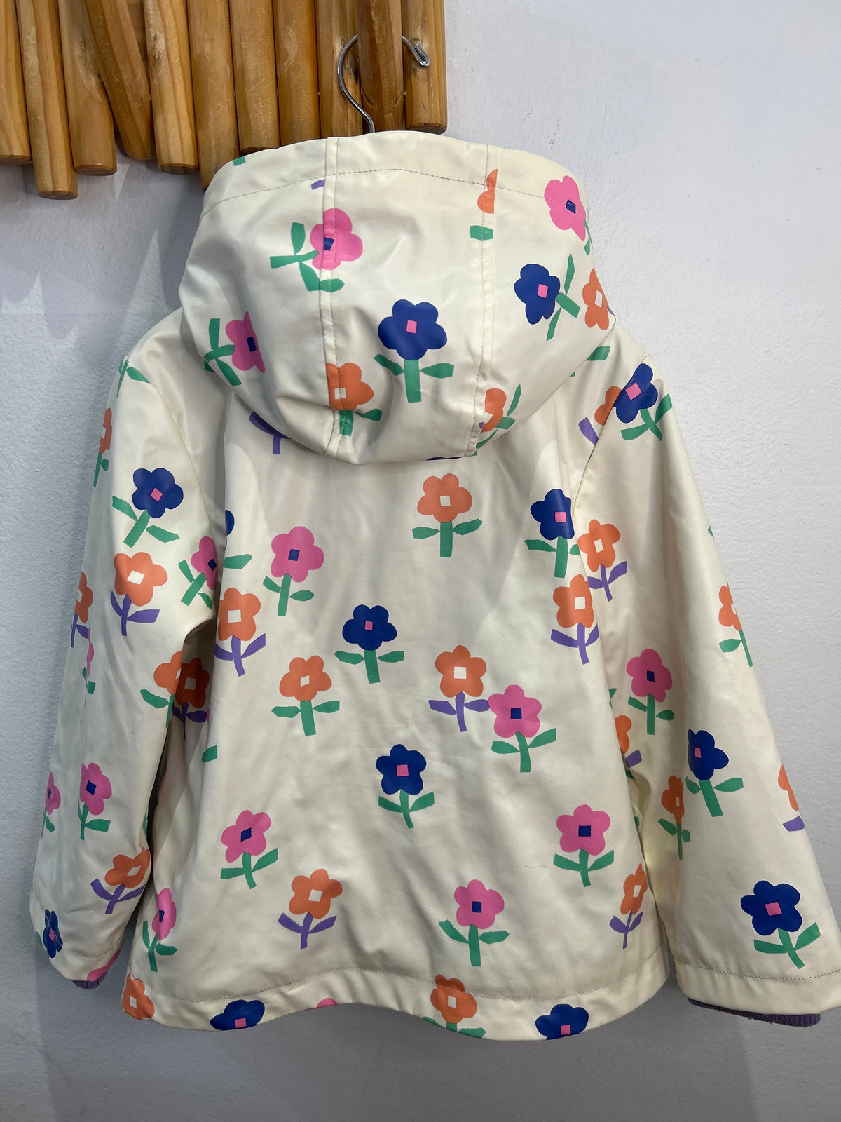 Purple fleece lined flowered rainjacket 4-5y