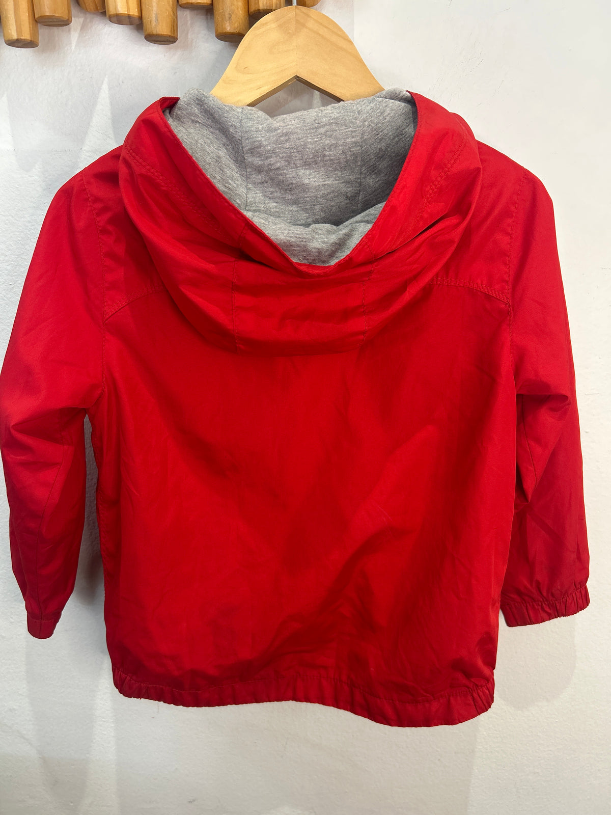 Red cotton lined rain jacket 4y