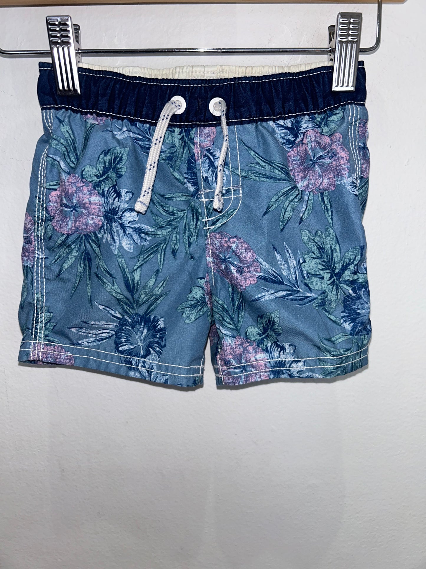 Blue floral swimshorts 12-18m