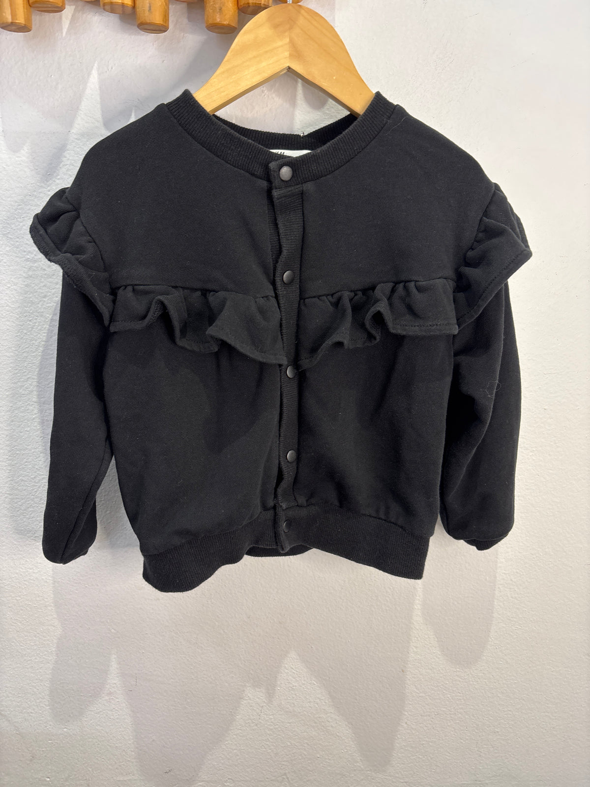 Black frilly bomber 2-4y