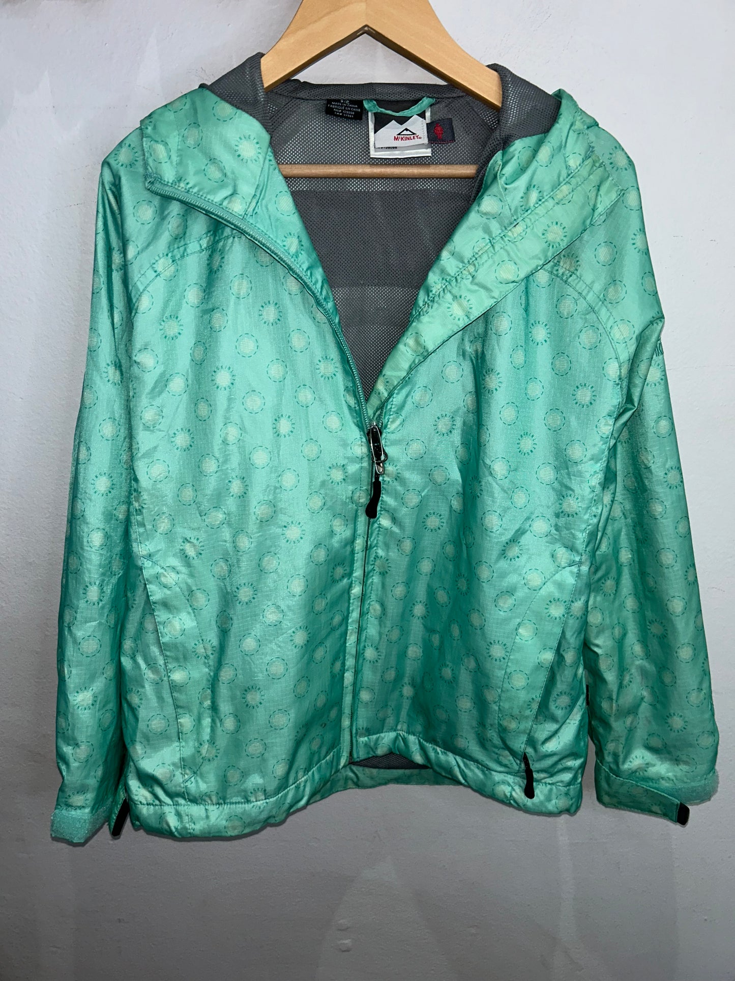 McKinley mint green rainjacket 8-10y