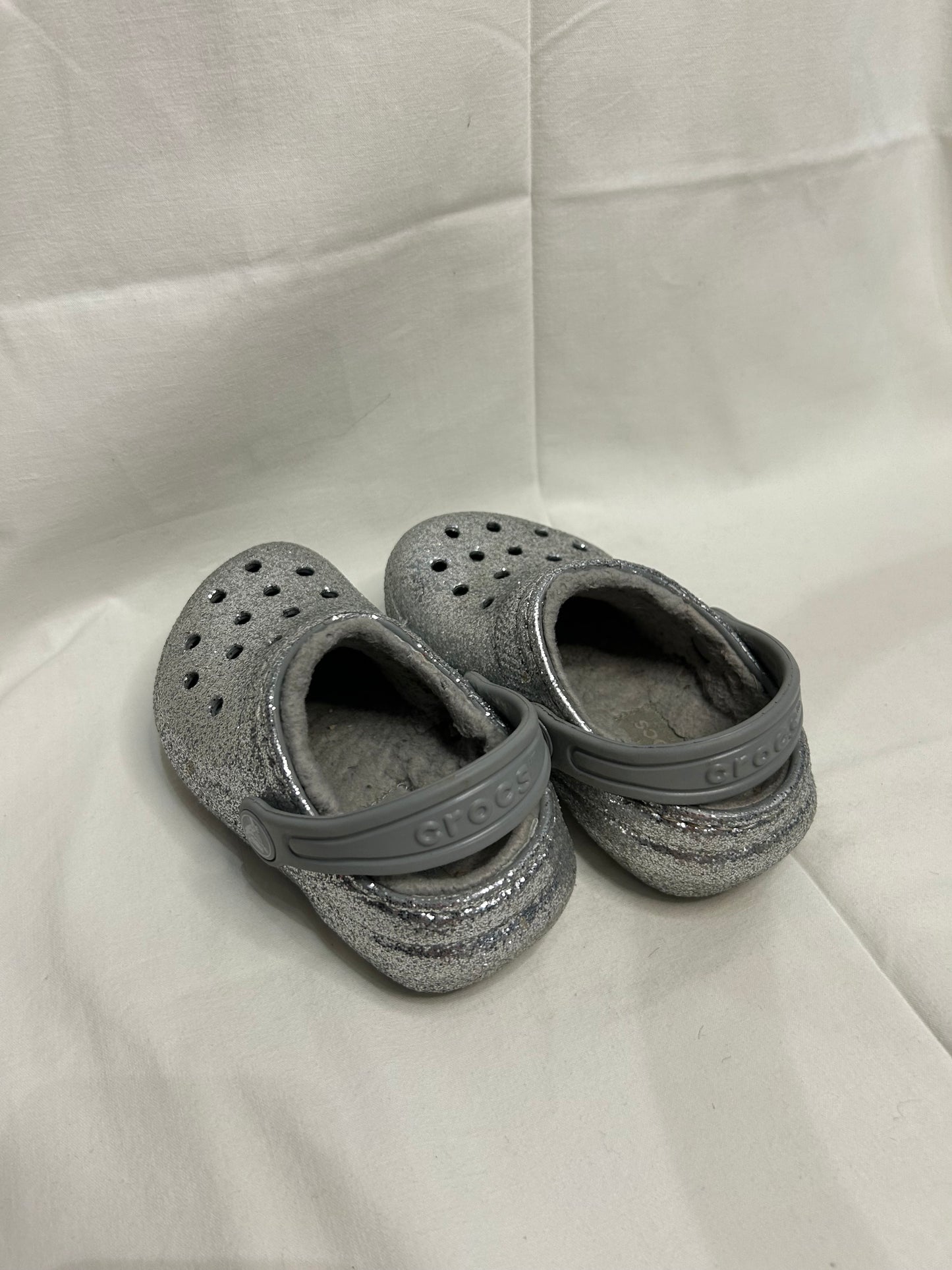 C7 silver lined Crocs