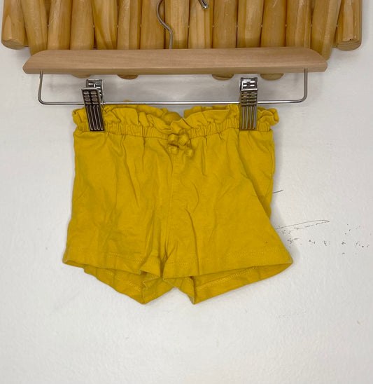 Yellow frilly shorts 12-18m