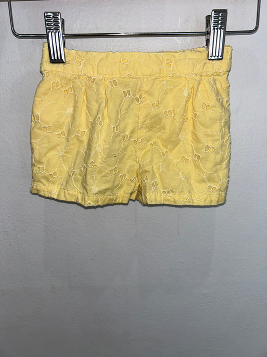 Yellow eyelet shorts 3-6m