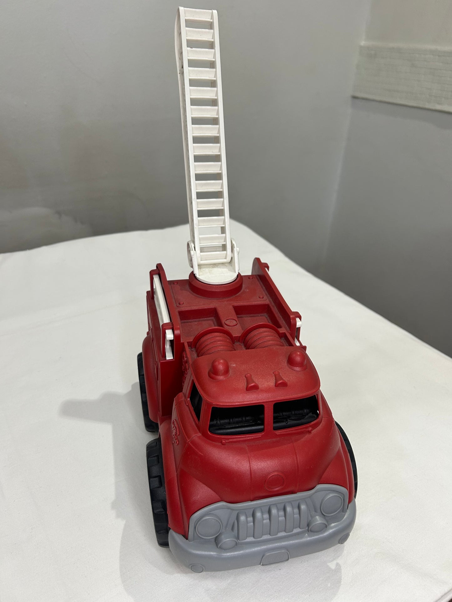 Green Toys red firetruck