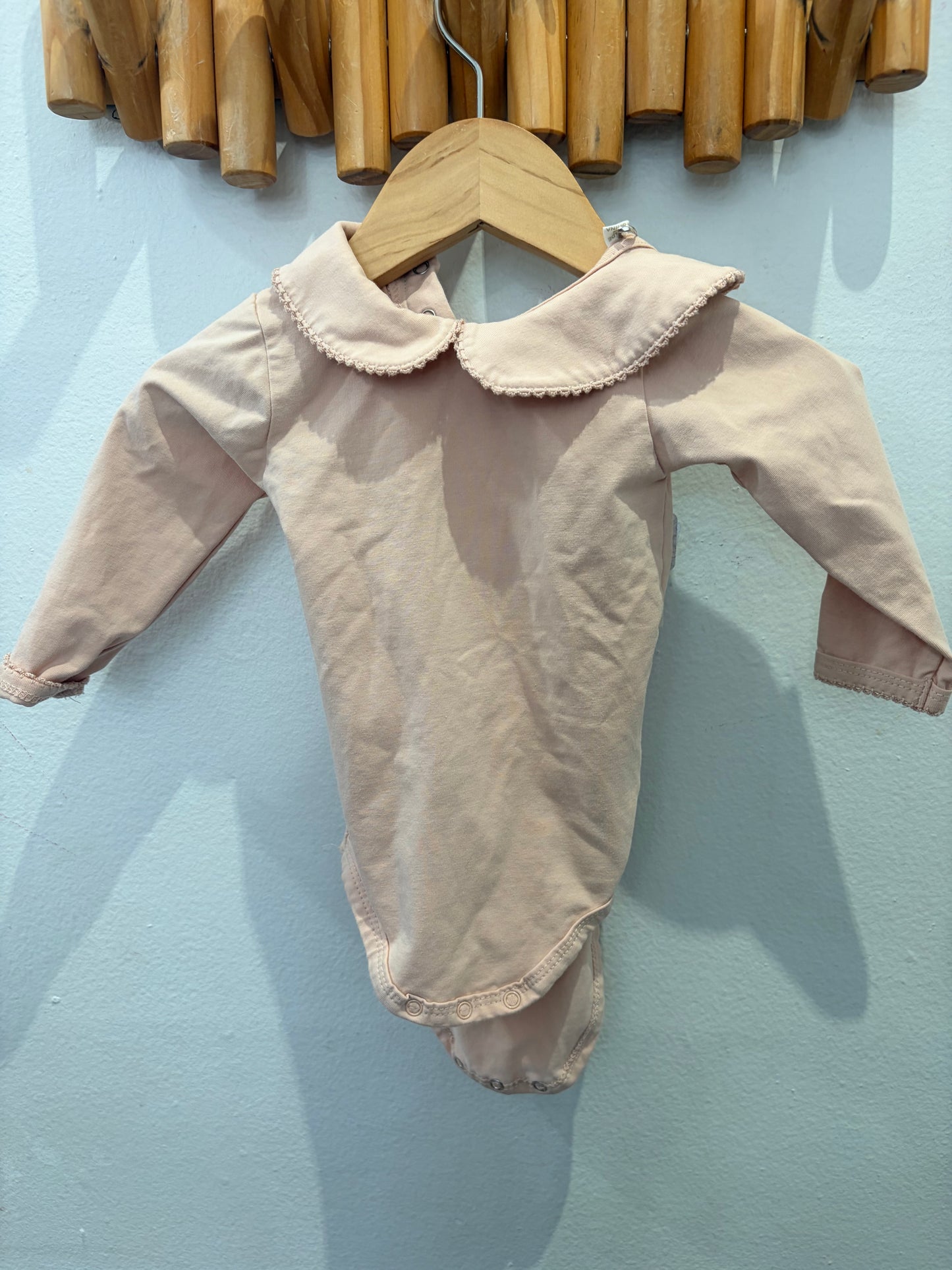 Light pink organic cotton onesie 0-3m