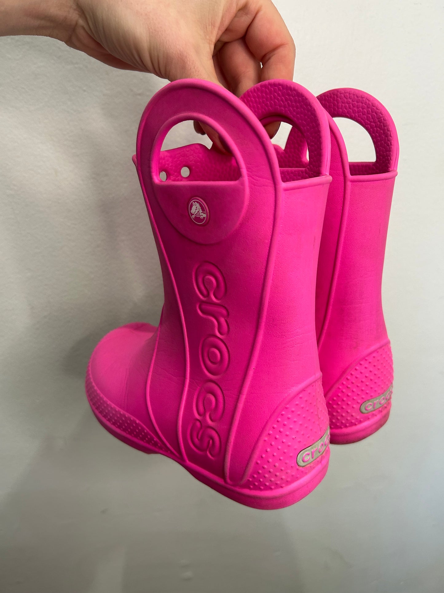 C12 hot pink Croc rain boots