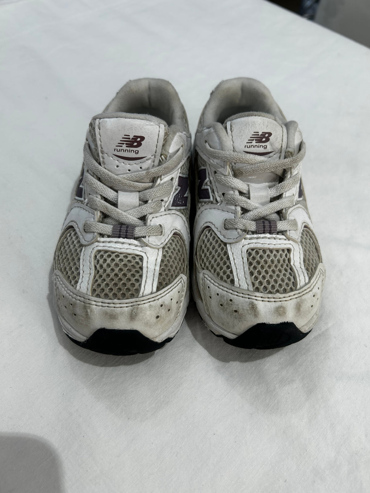 C8 New Balance purple logo