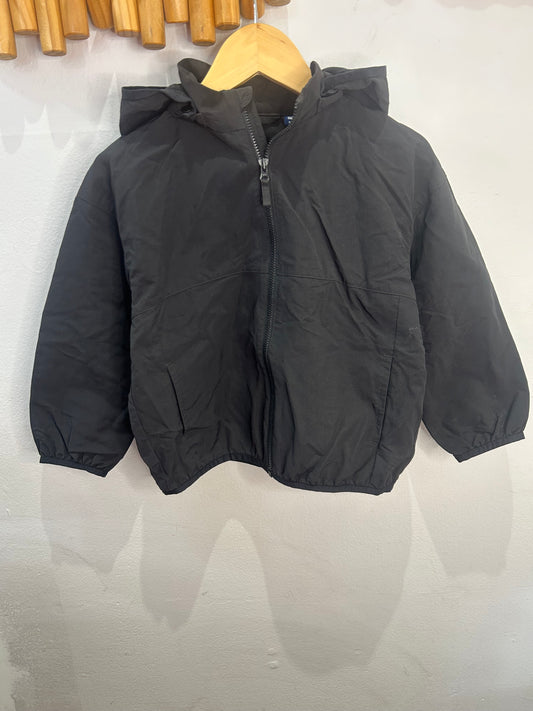 Black pocketable rainjacket 3-4y