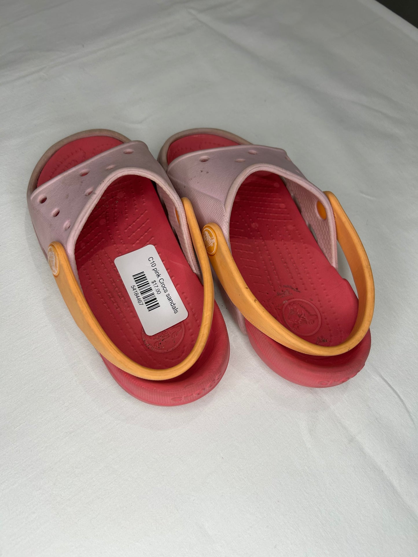 C10 pink Crocs sandals