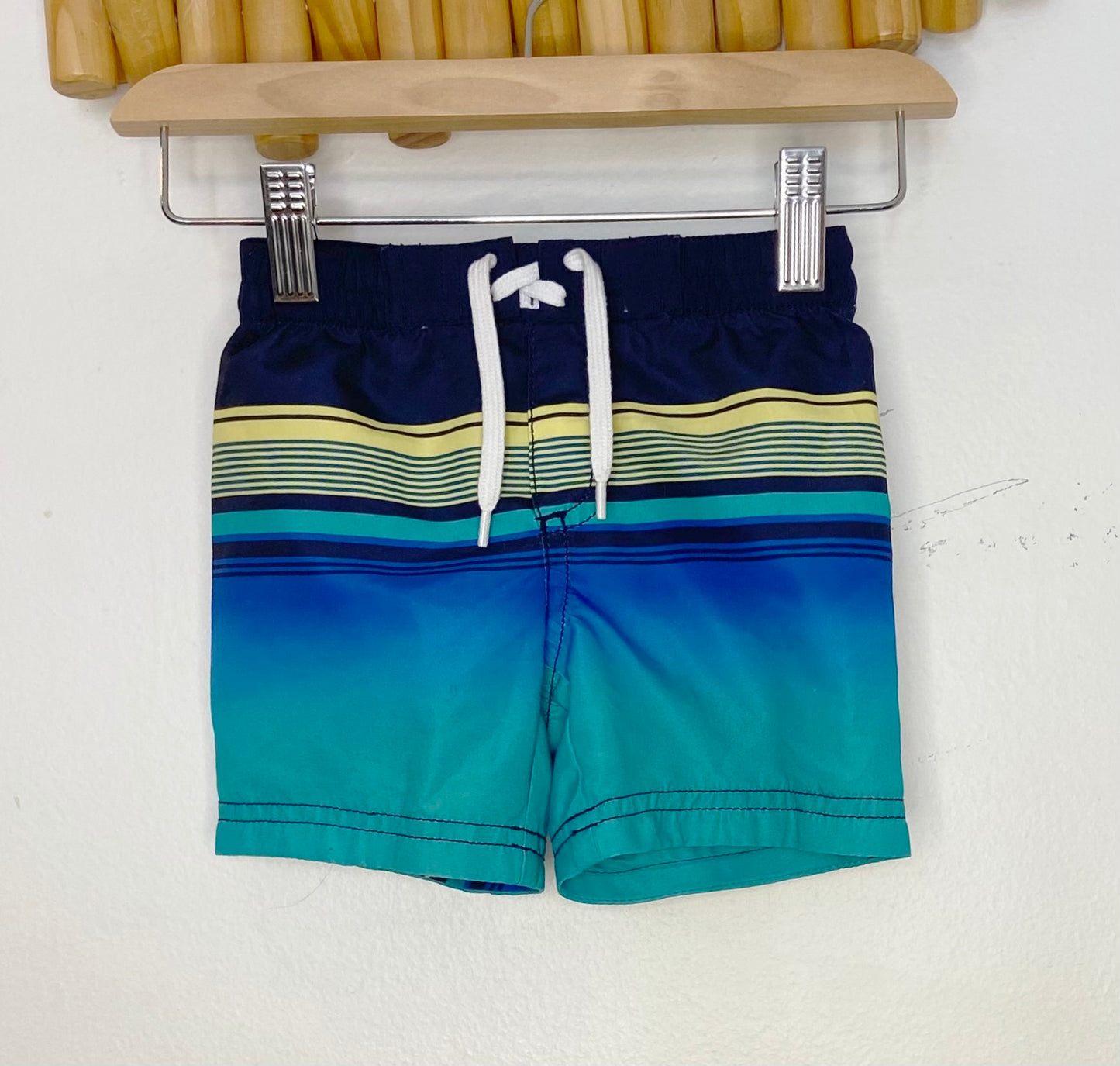 Blue and yellow swim shorts 12-18m