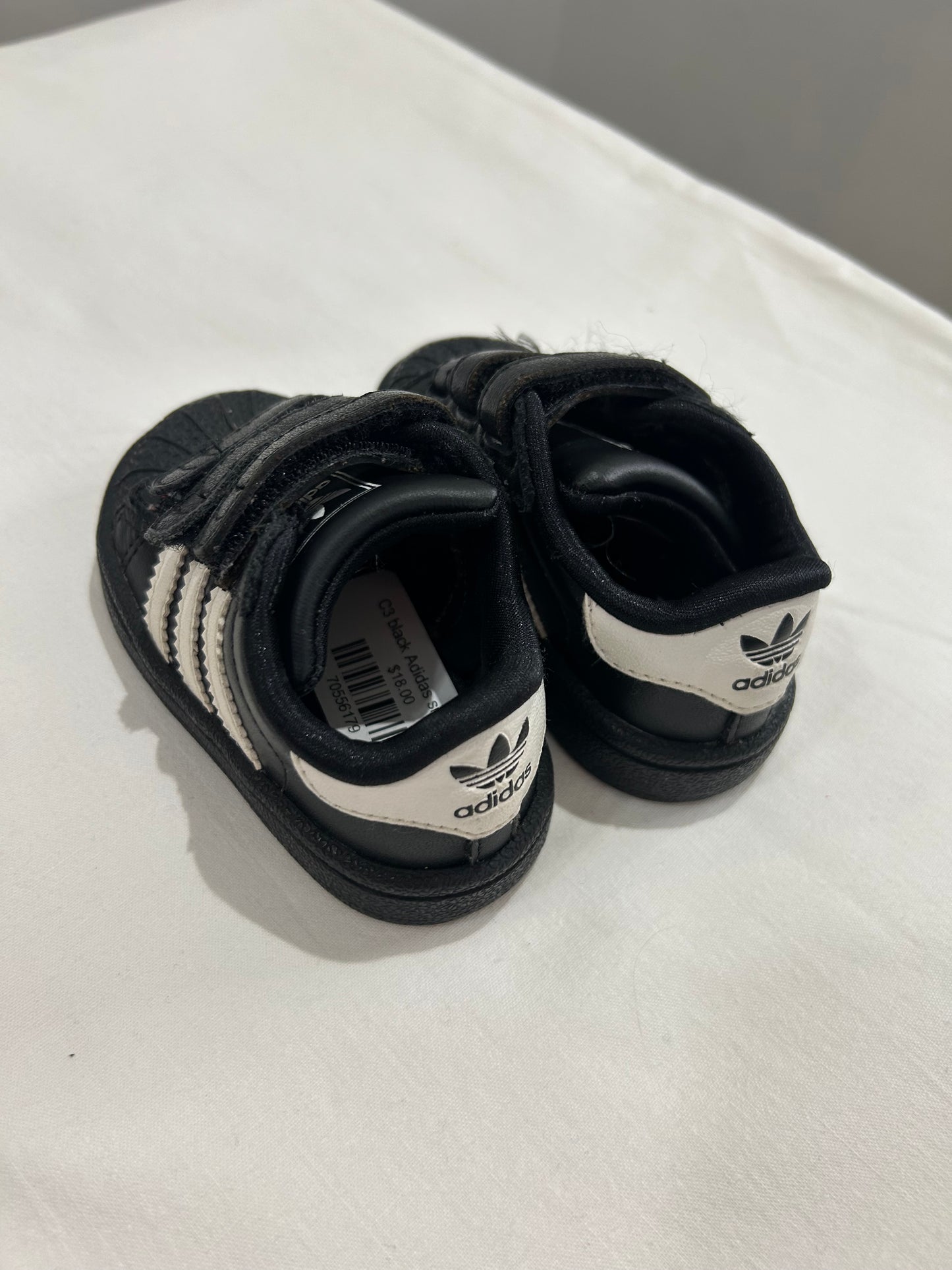 C3 black Adidas sneakers