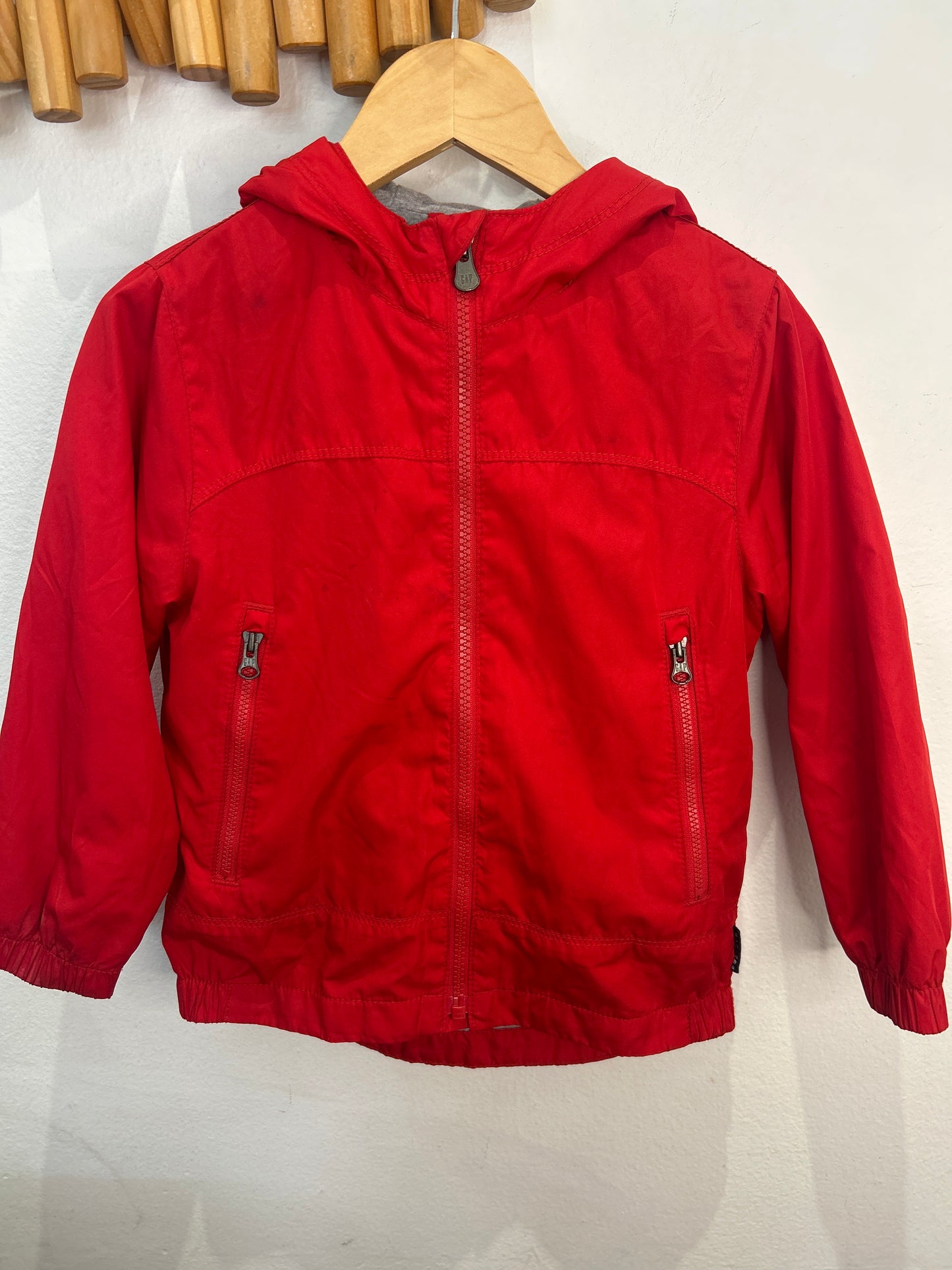 Red cotton lined rain jacket 4y