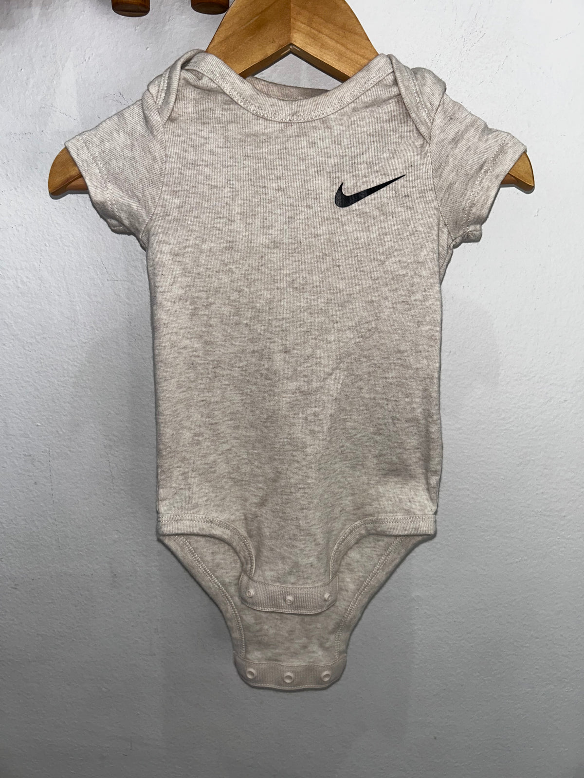 Beige Nike onesie 6m