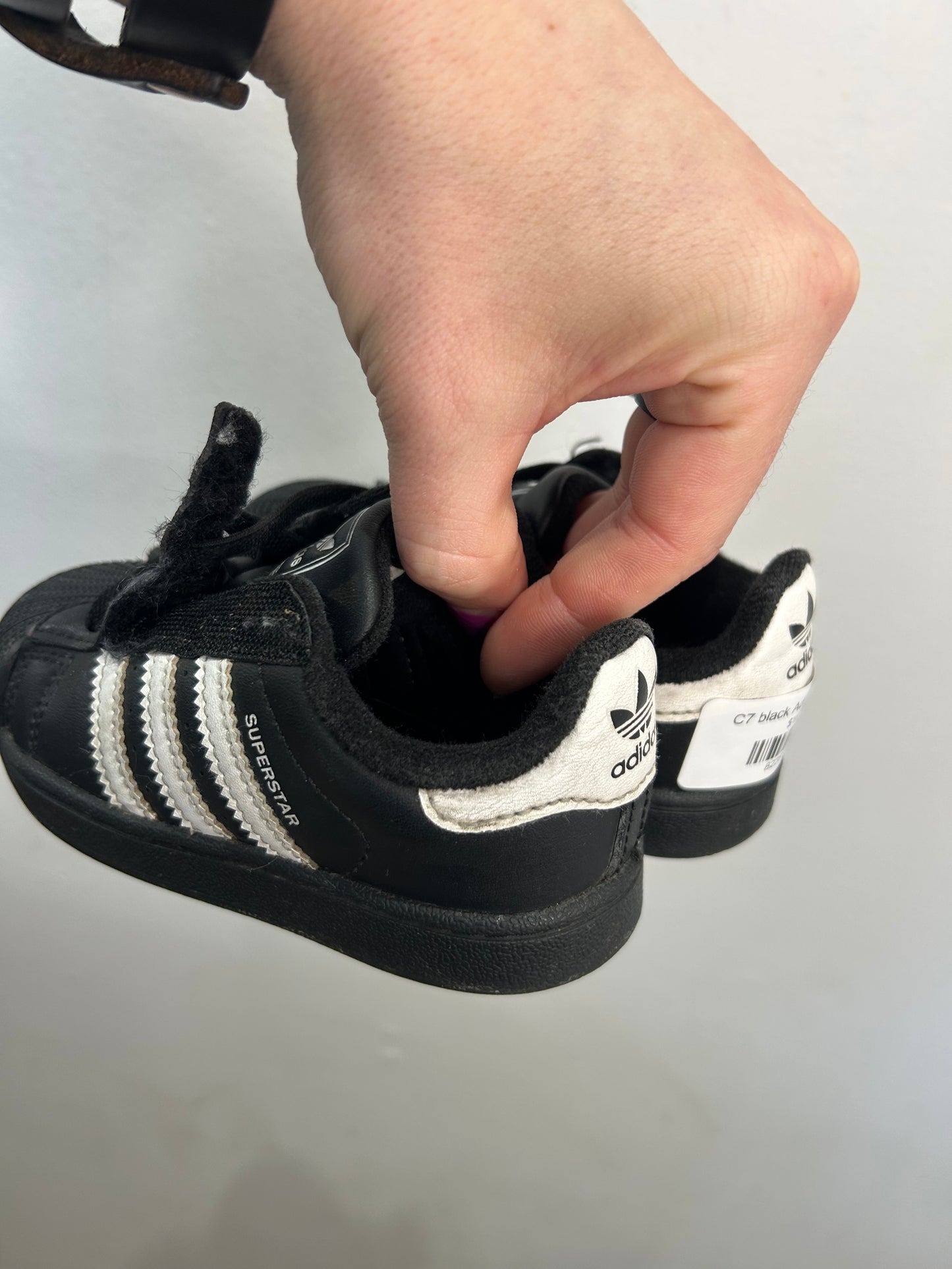 C7 black Adidas runners