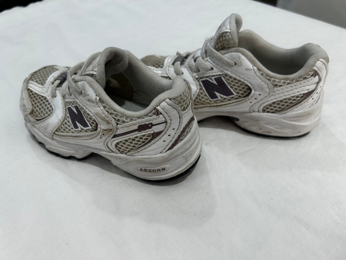 C8 New Balance purple logo