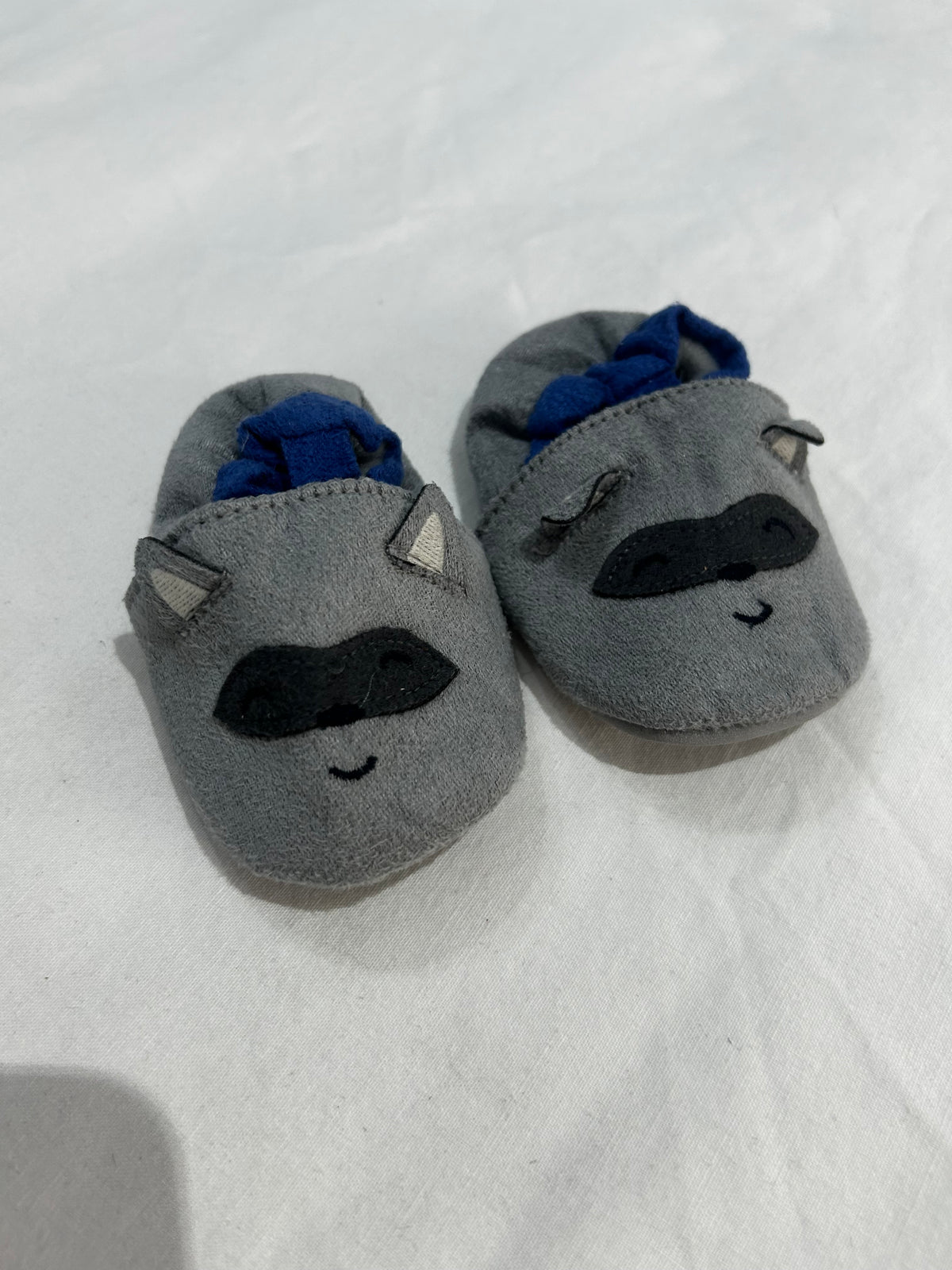 Navy racoon soft soles 0-6m