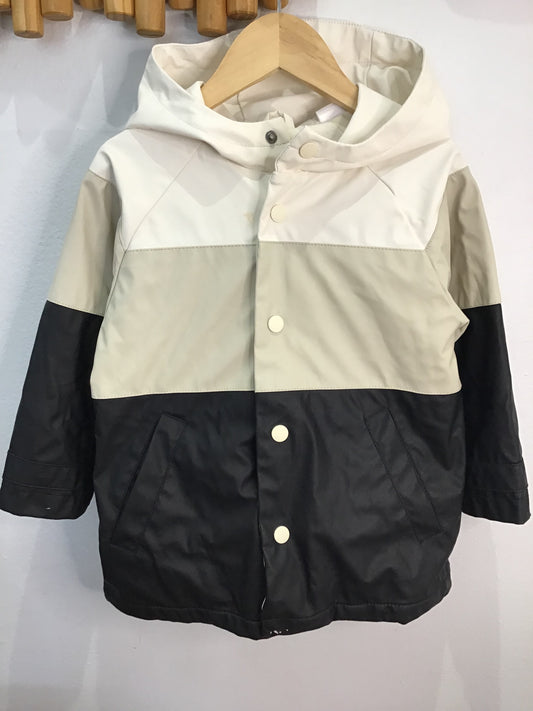 Black and cream rain jacket 18-24m