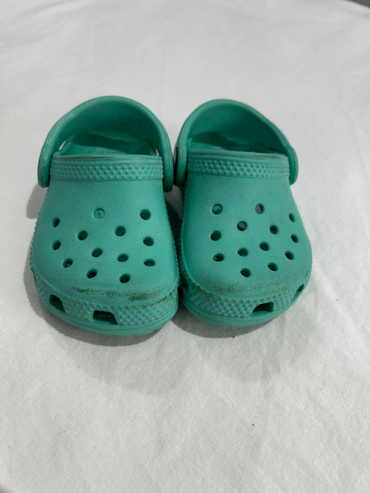 C4 teal Crocs