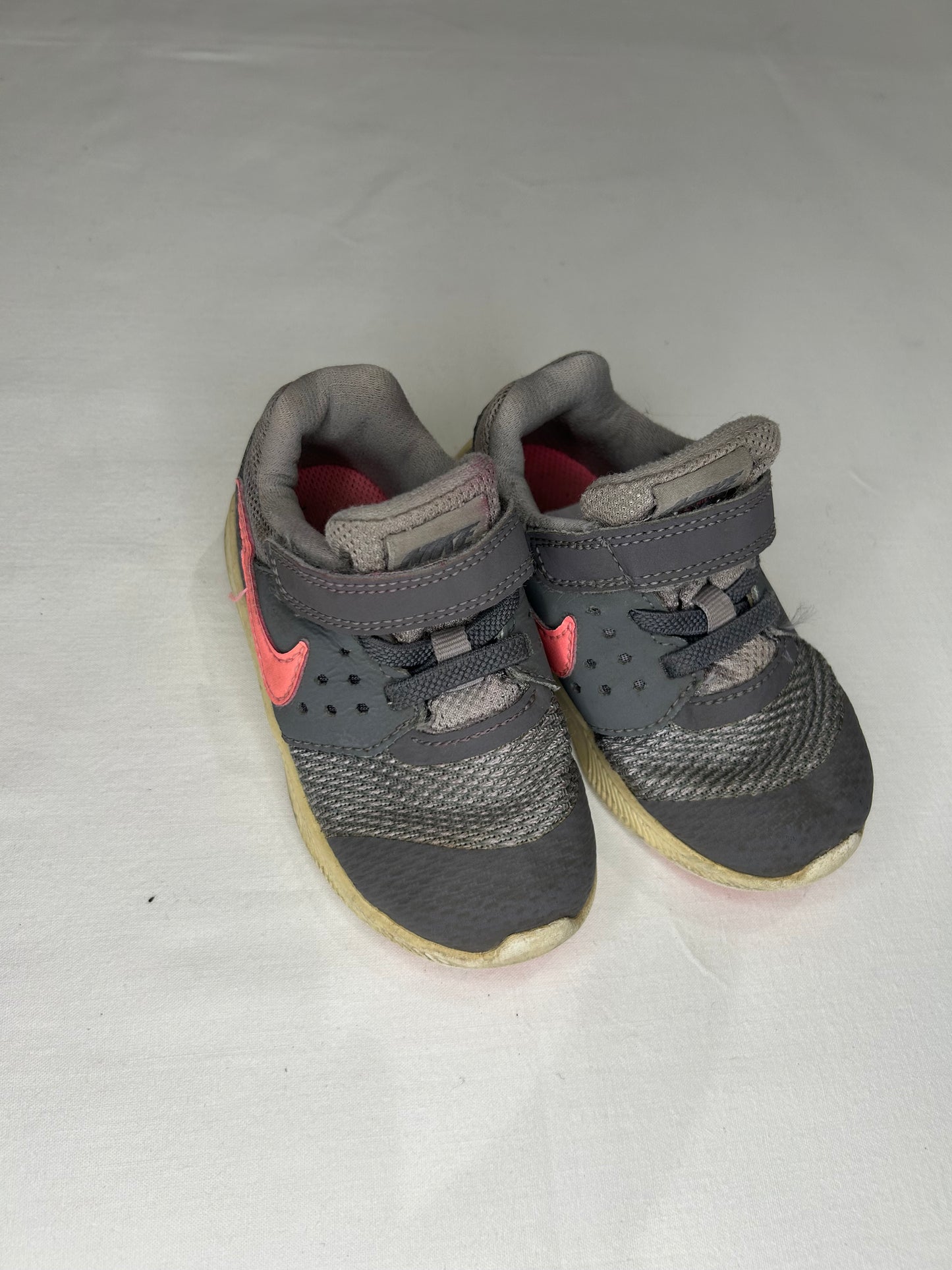 C7 grey Nikes pink swoosh