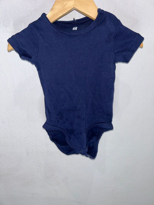 Navy short-sleee onesie 2-4m