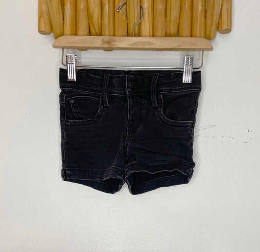 Stretchy black short shorts 3-4y