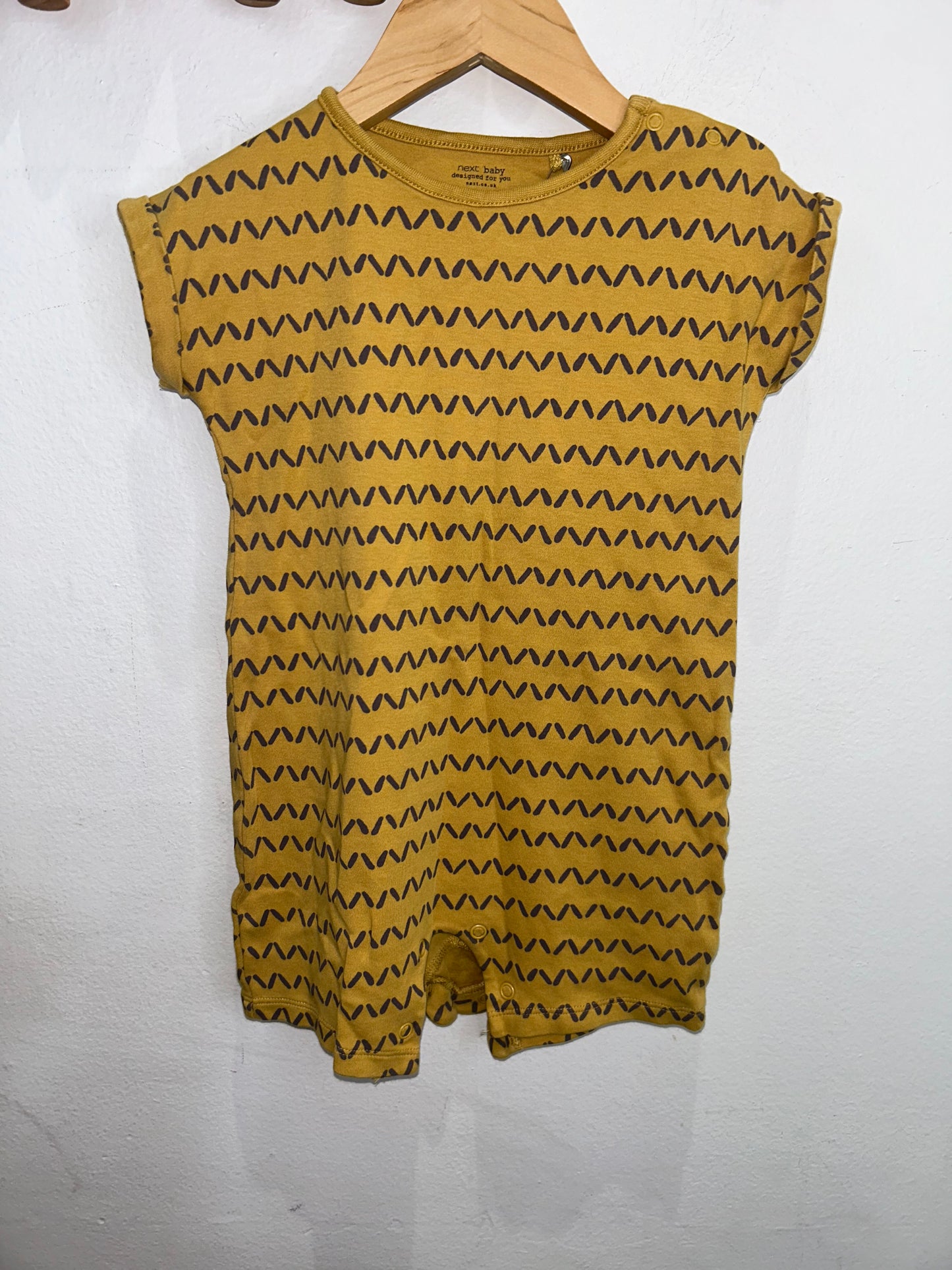Yellow pattern shorty romper 2-3y