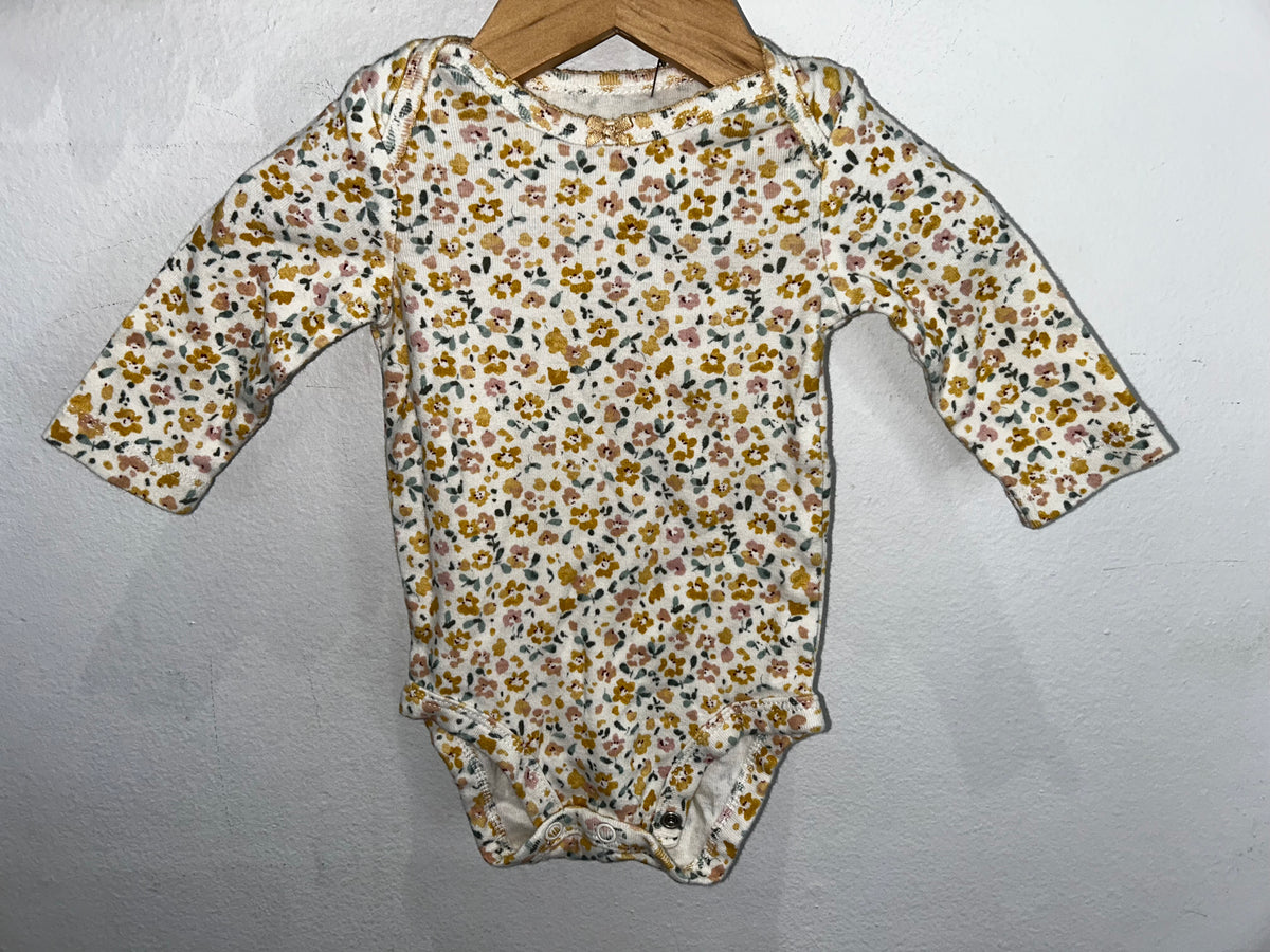 Yellow floral onesie 3m