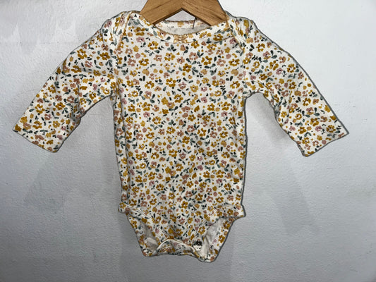 Yellow floral onesie 3m