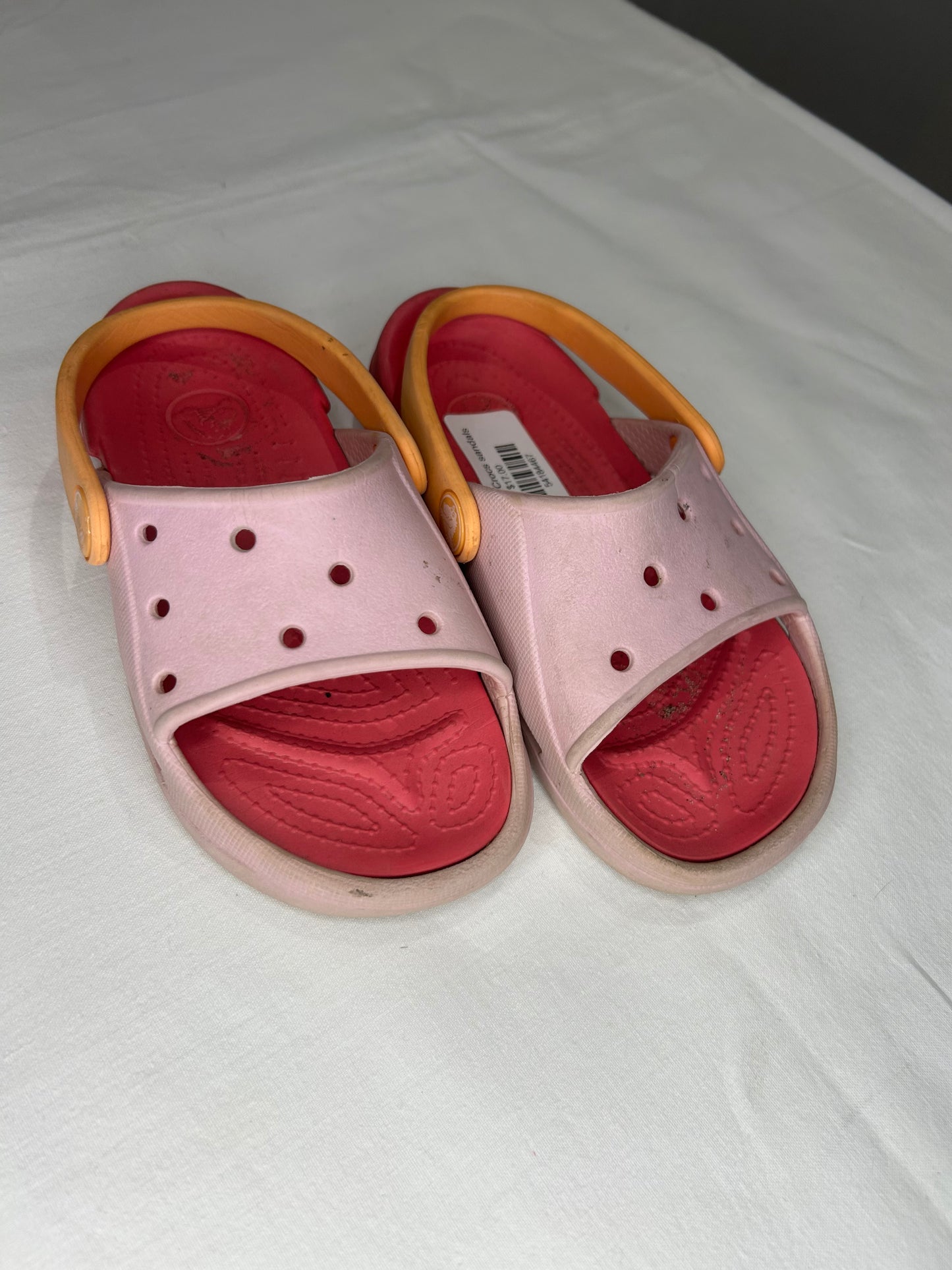 C10 pink Crocs sandals