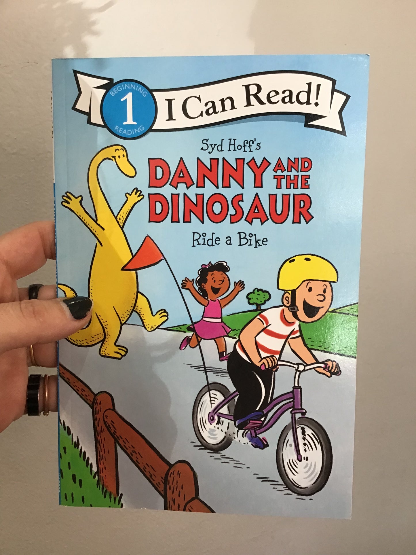 Danny and the Dinosaur ride a bike