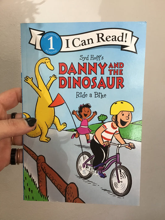 Danny and the Dinosaur ride a bike