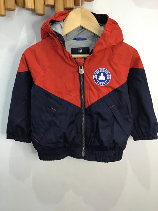 Red and navy cotton-lined rainjacket 12-18m