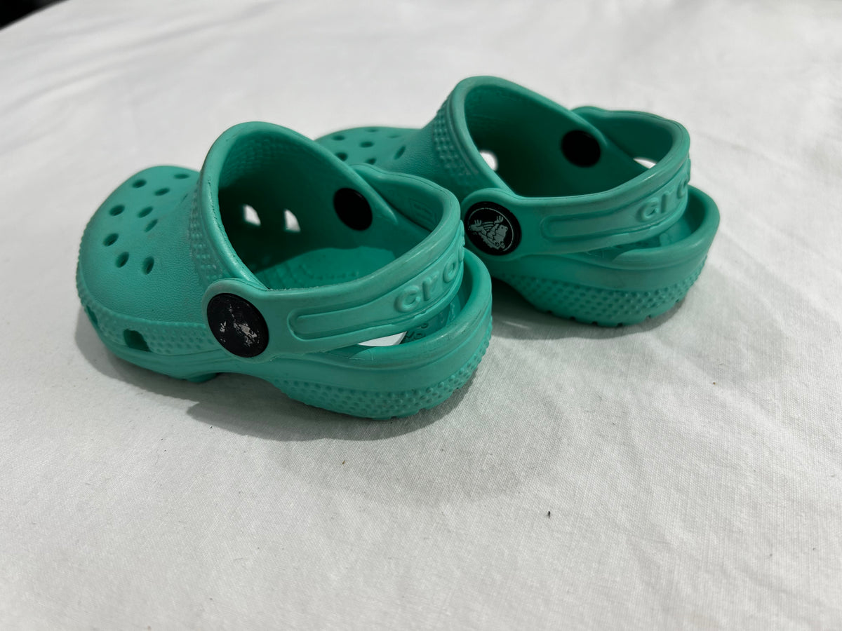C4 teal Crocs