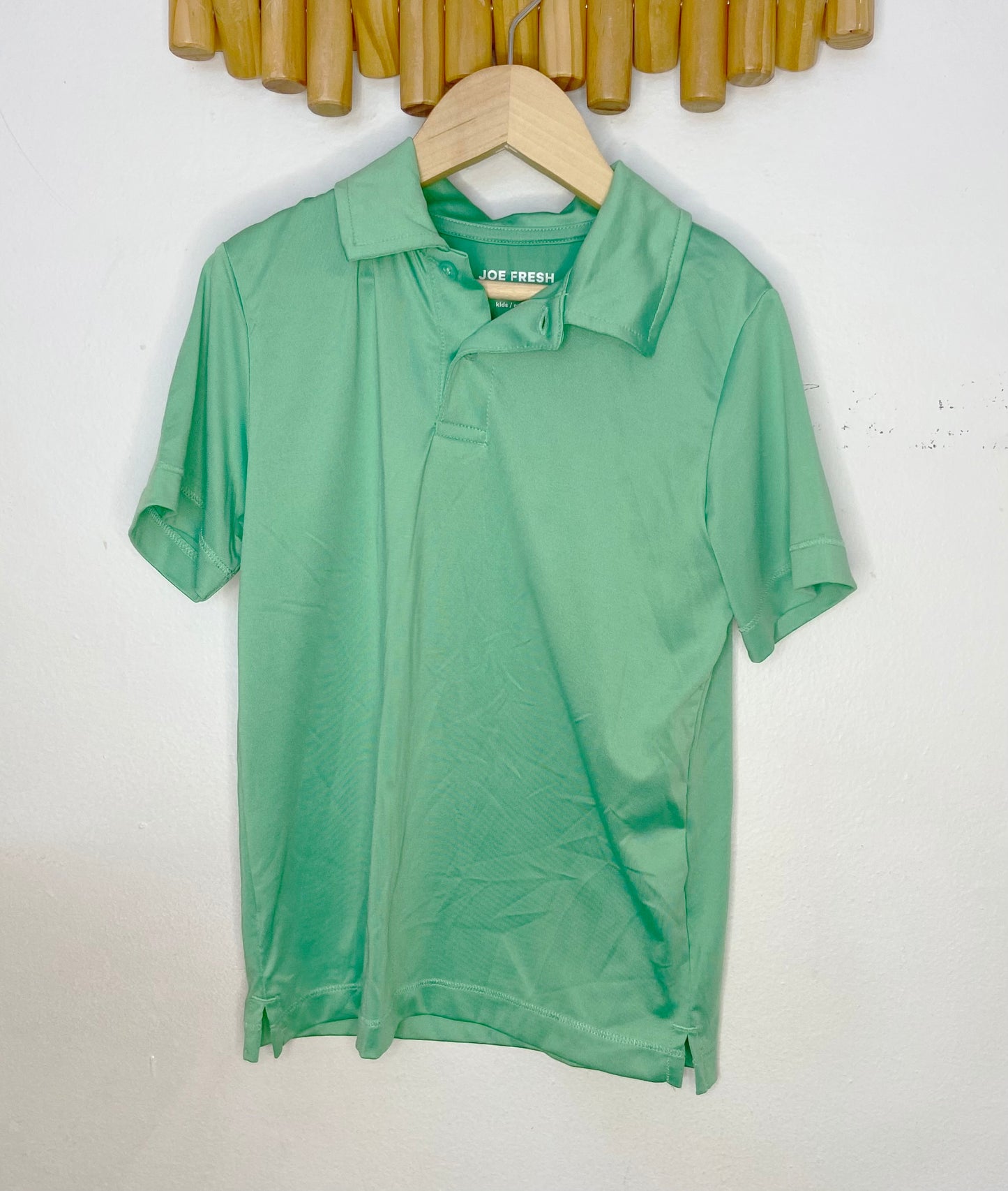 Green activewear polo 6y