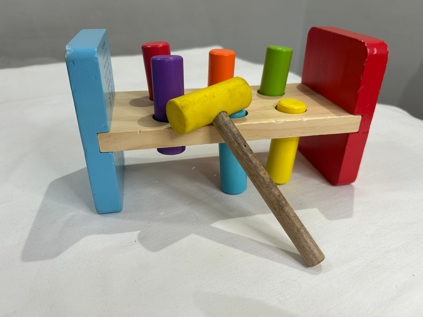 Pounding bench with hammer