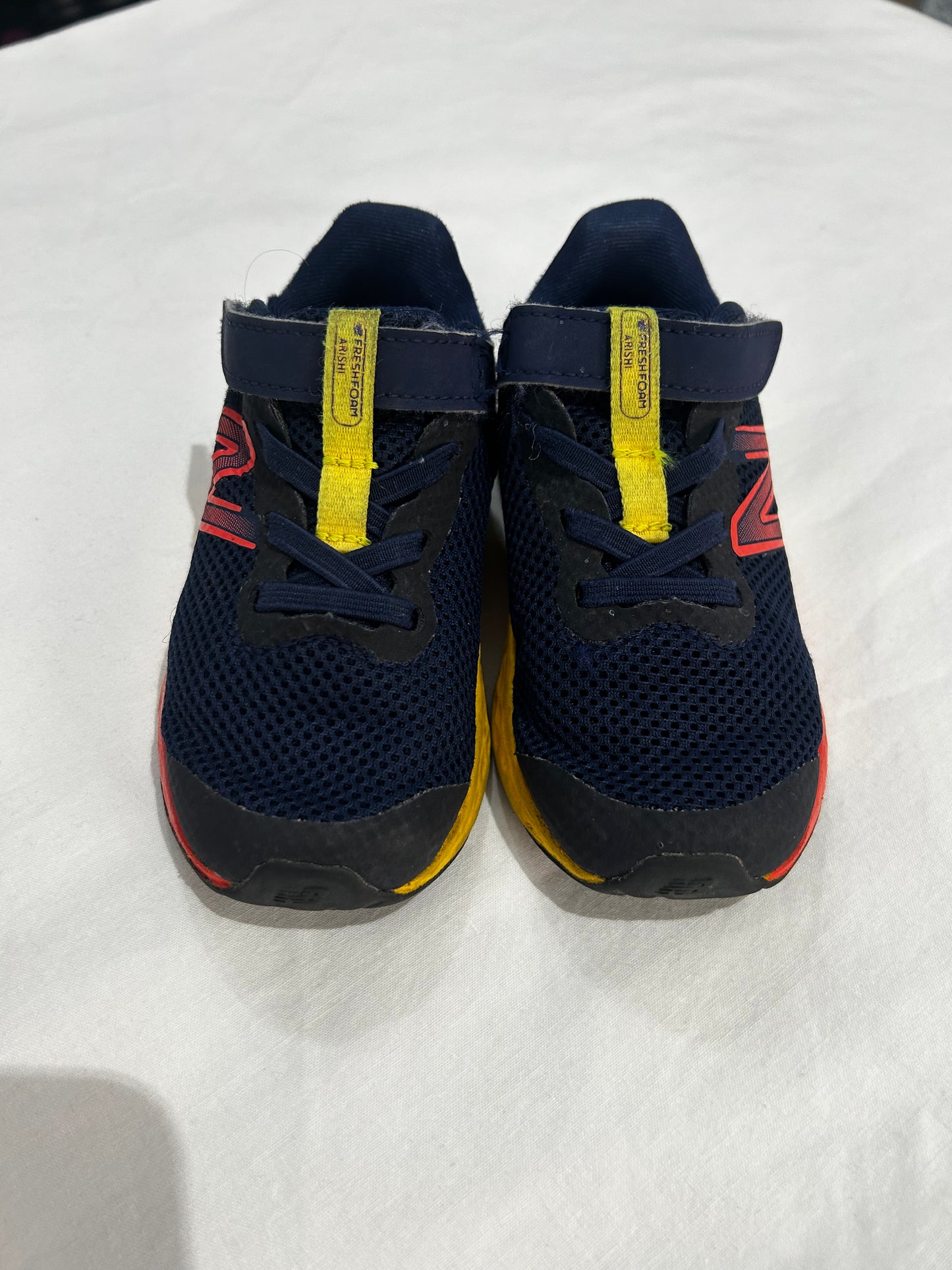 C8 New Balance navy and neon runners