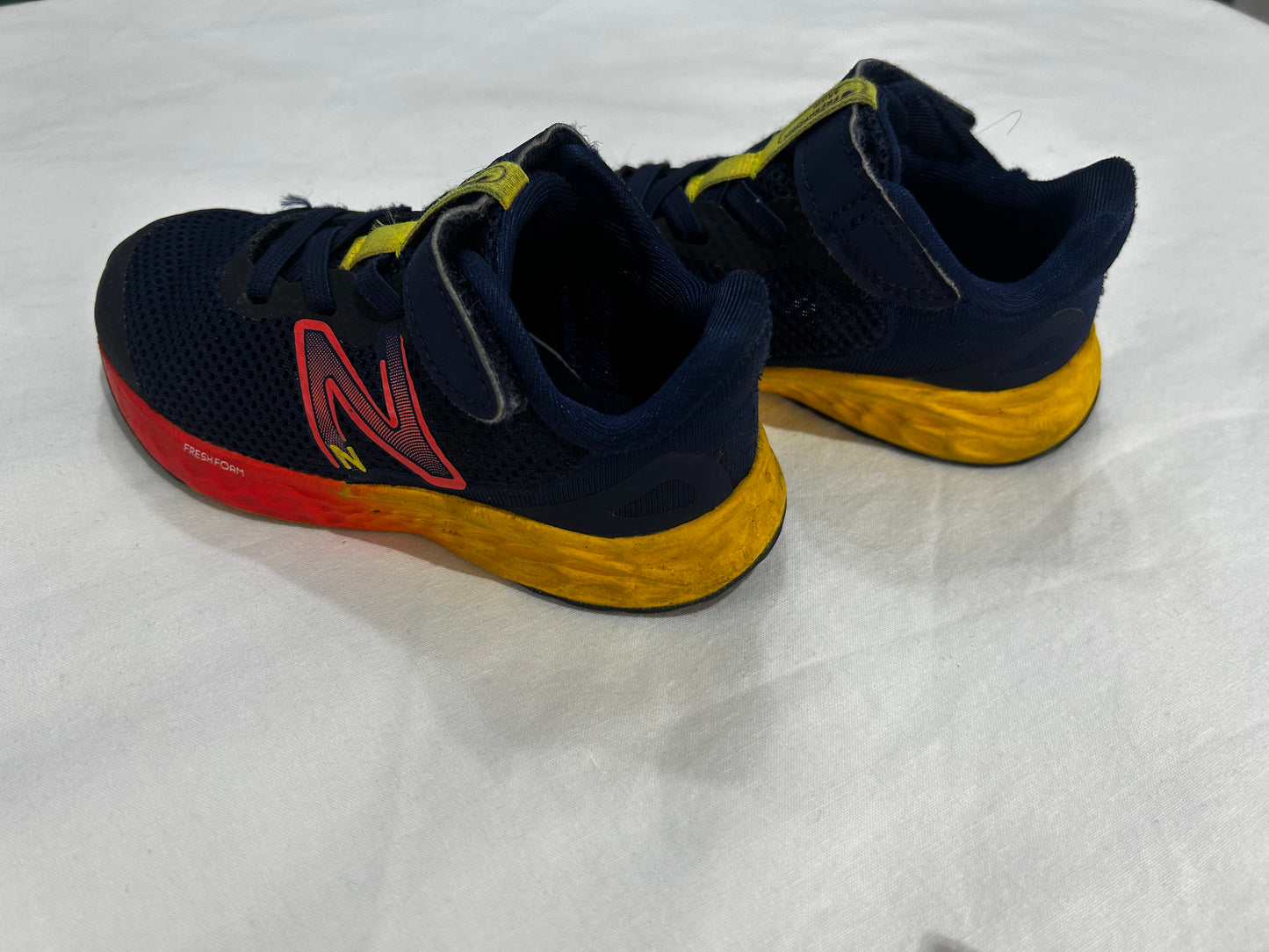 C8 New Balance navy and neon runners